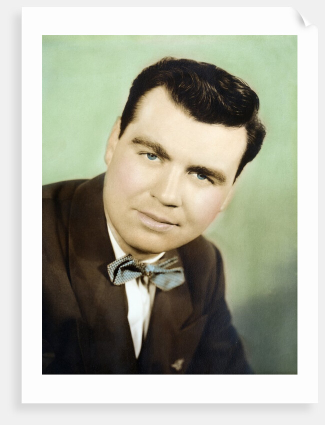 Mature man colorized studio portrait, ca. 1955. by Anonymous