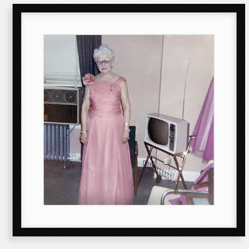 Grandma is all dressed up and standing next to a TV, ca. 1965 by Anonymous