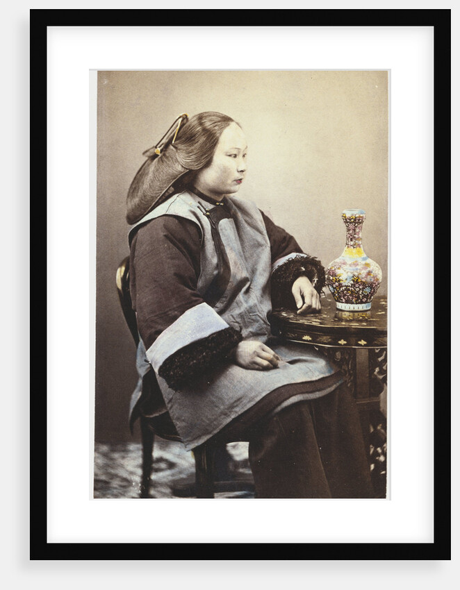 A hand tinted photograph of a young Chinese woman by Anonymous