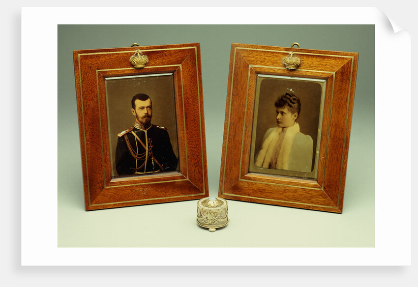 A pair of hand-coloured photos of Tsar Nicholas II & Alexandra and a cylindrical bowentie silver-mounted bell-push, marked Faberge by Anonymous