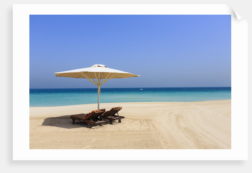 Parasol and recliner on the beach, Dubai by Anonymous