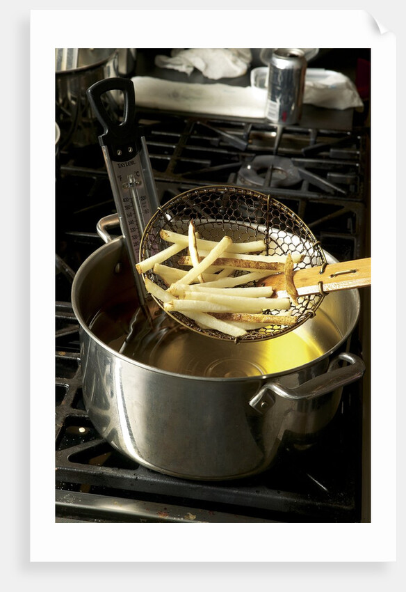 French fries in oil by Anonymous