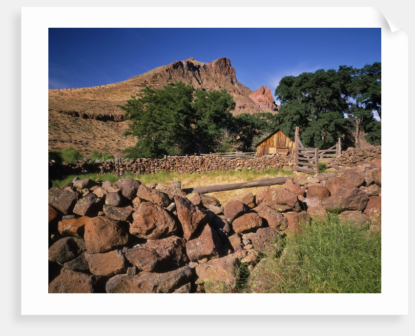 Stone corral fence and barn by Anonymous