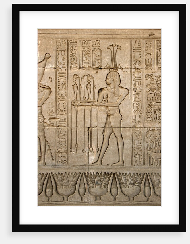 Ancient Egyptian sunken relief depicting the god of Nile, Hapy, and hieroglyphs by Anonymous