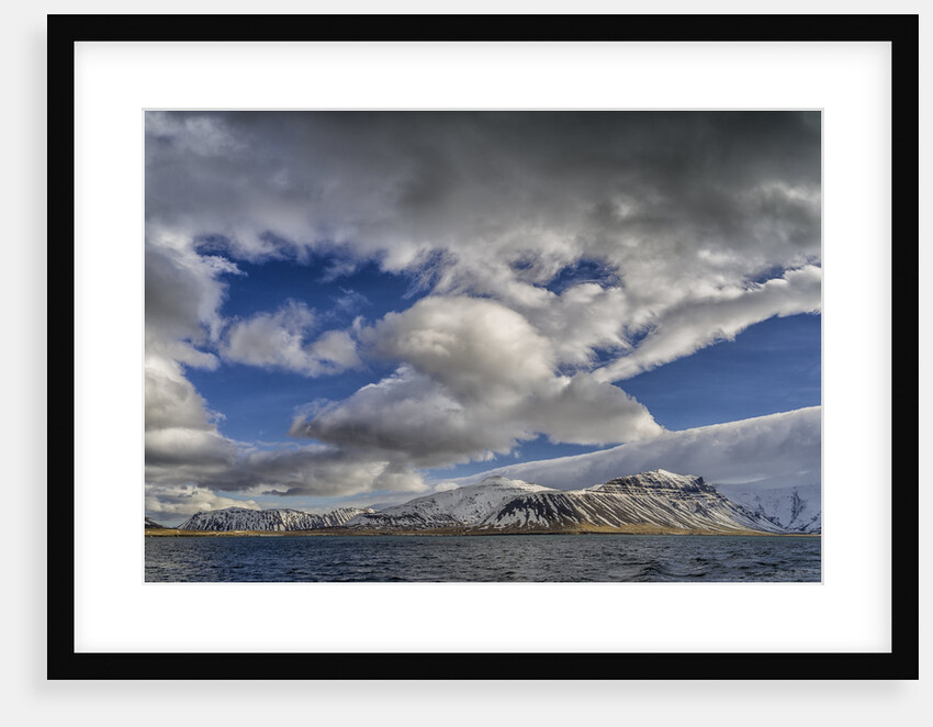 Clouds over fjord in the winter. by Anonymous