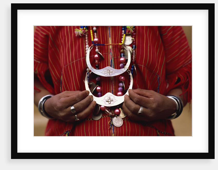 Woman holding tribal jewelry, Chiang Rai, Thailand by Anonymous
