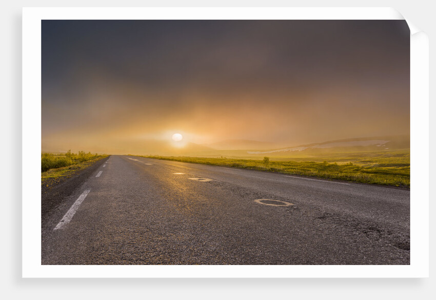 Empty road with fog and sunset. by Anonymous