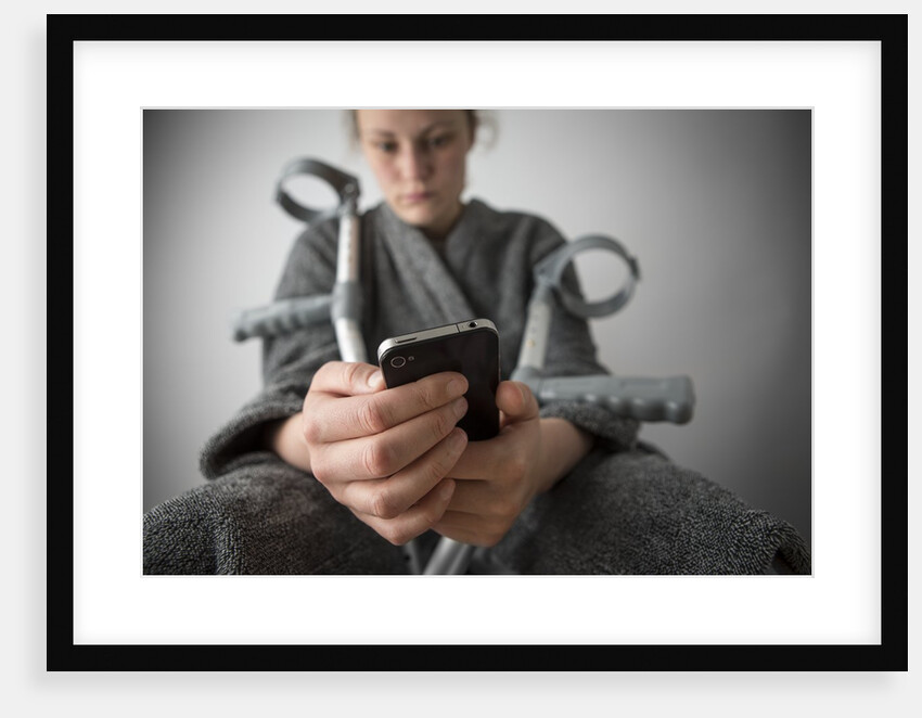 Woman seated with crutches by Anonymous