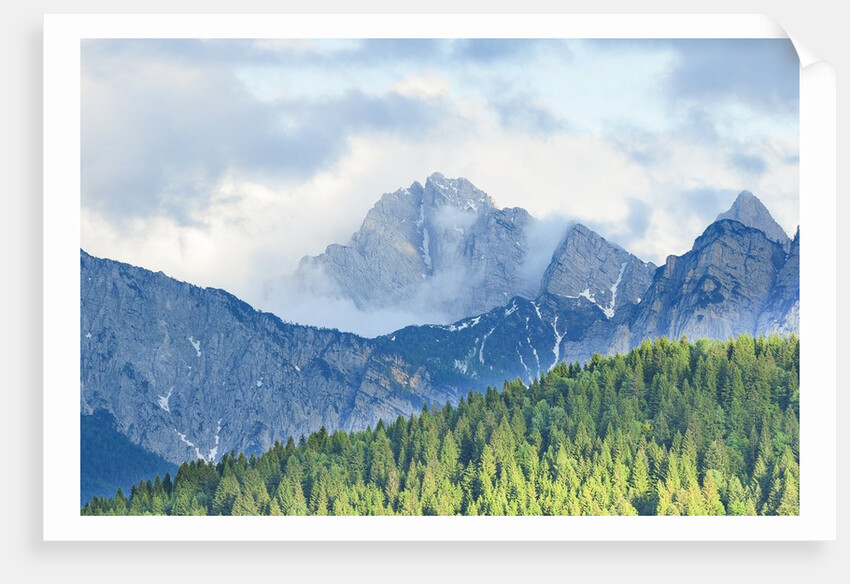 The mount Sernio emerges from the clouds and stands with majesty abiove the green woods, Alpi Carnic by Anonymous