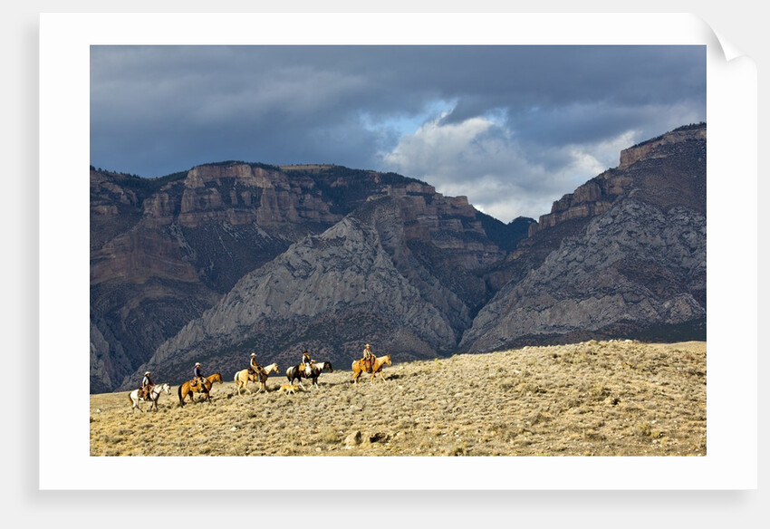 Cowboys and Cowgirls riding along the hills of the Big Horn Mountains by Anonymous
