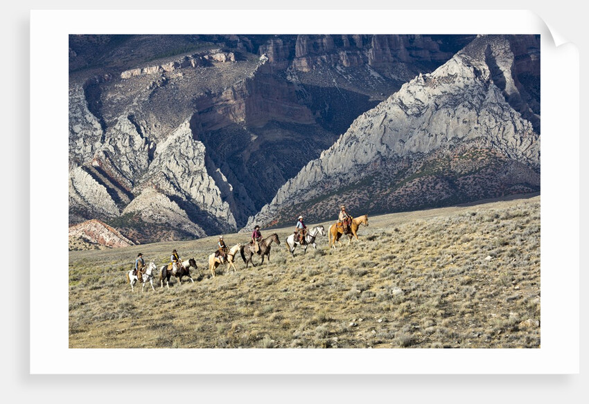 Cowboys and Cowgirls riding along the hills of the Big Horn Mountains by Anonymous