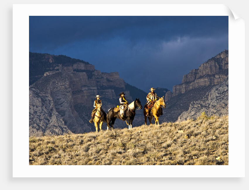 Cowboys and Cowgirls riding along the hills of the Big Horn Mountains by Anonymous