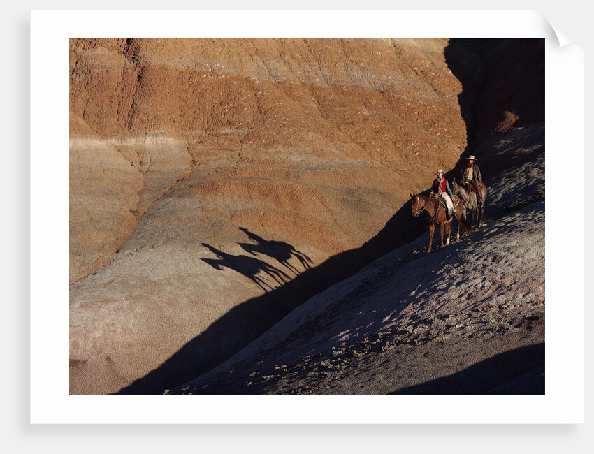 Riders with Shadow coming down Hill in Painted Desert by Anonymous