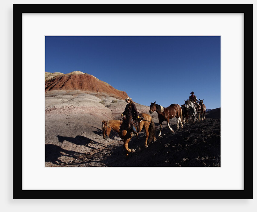 Riders and Horses with Shadows coming down Hill in Painted Desert by Anonymous