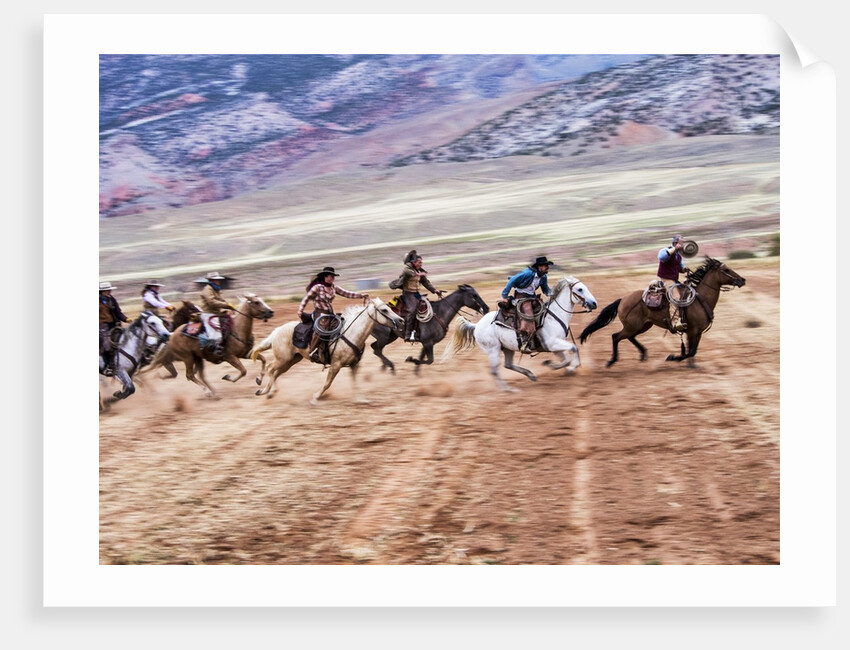 Cowboy's in motion across the field by Anonymous