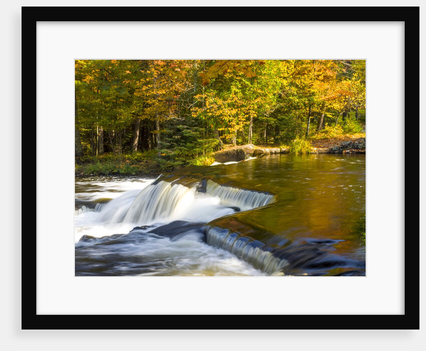 Trees reflect in cascade above Bond Falls on the Middle Fork of the Ontonagon river near Paulding in by Anonymous