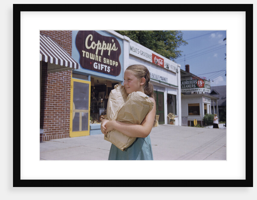 Girl Carrying Paper Shopping Bags by Anonymous