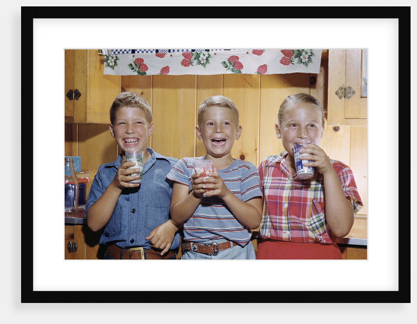 Happy Children Enjoying Glass of Cold Milk by Anonymous