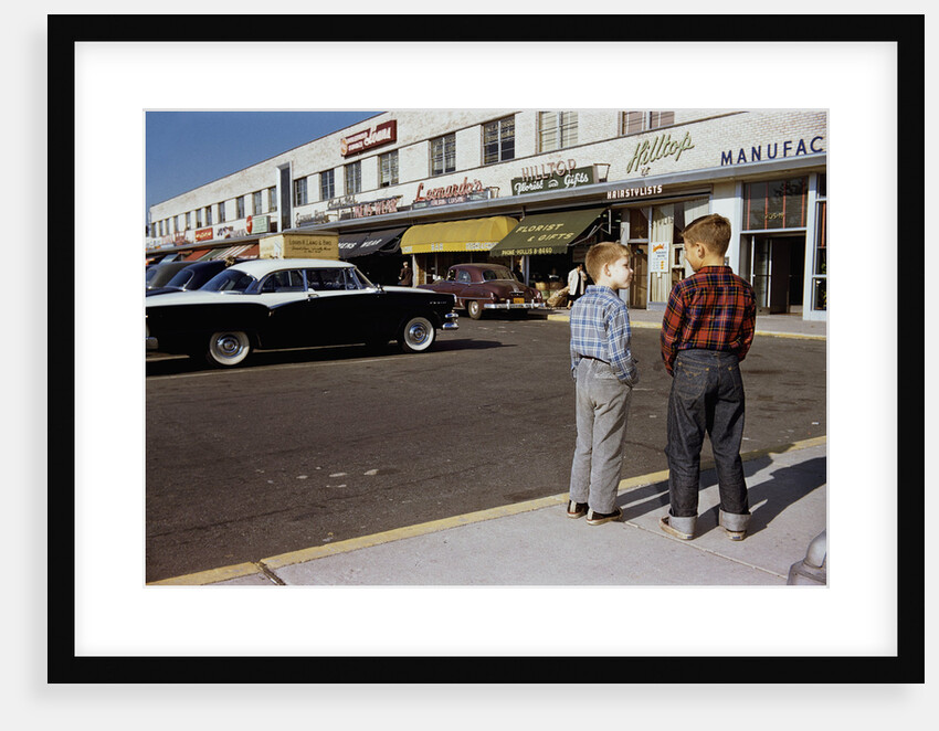 Boys Standing Alongside Strip Mall Parking Lot by Anonymous