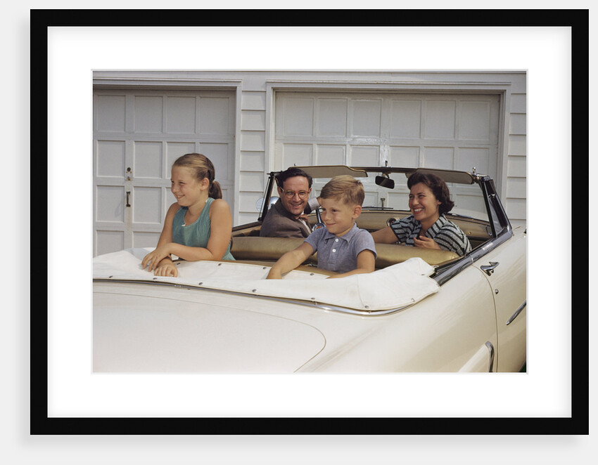 Family Sitting in Car Outside Garage by Anonymous