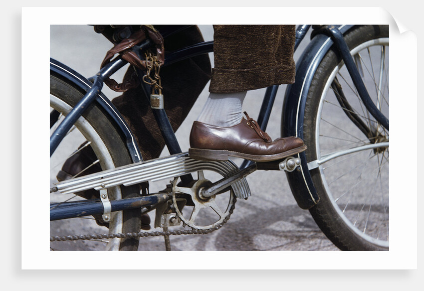 Man Riding Bicycle in Dress Shoes by Anonymous
