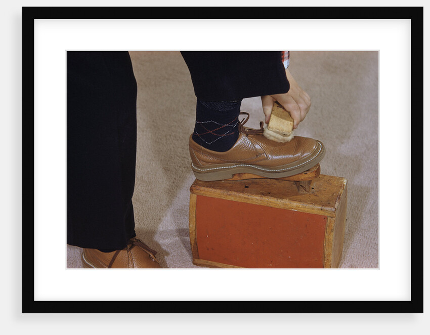 Man Buffing His Shoes by Anonymous