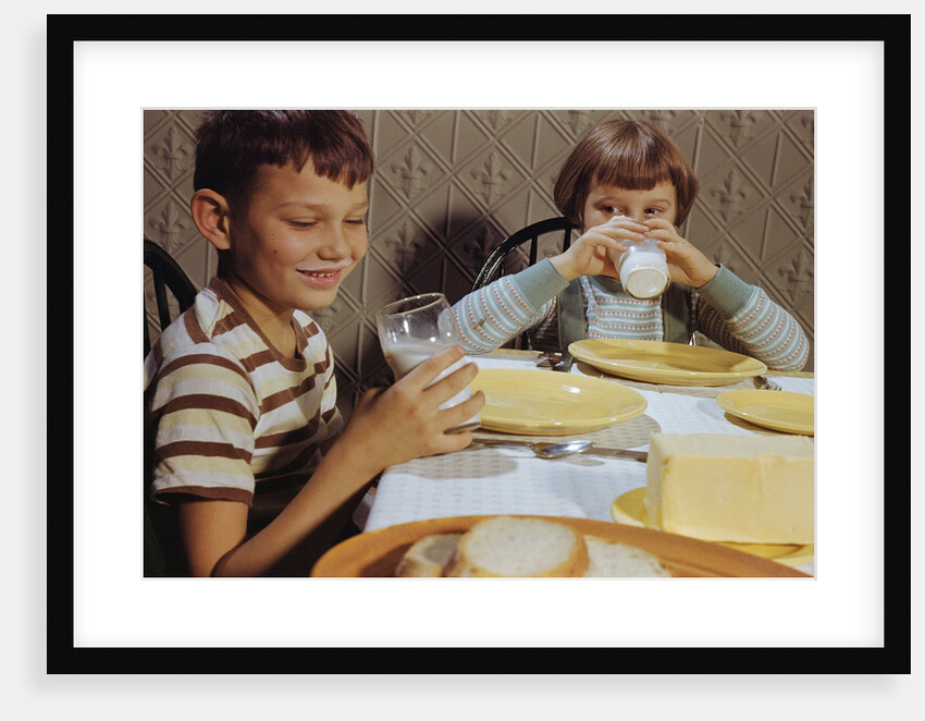 Children Drinking Milk at Dinner Table by Anonymous