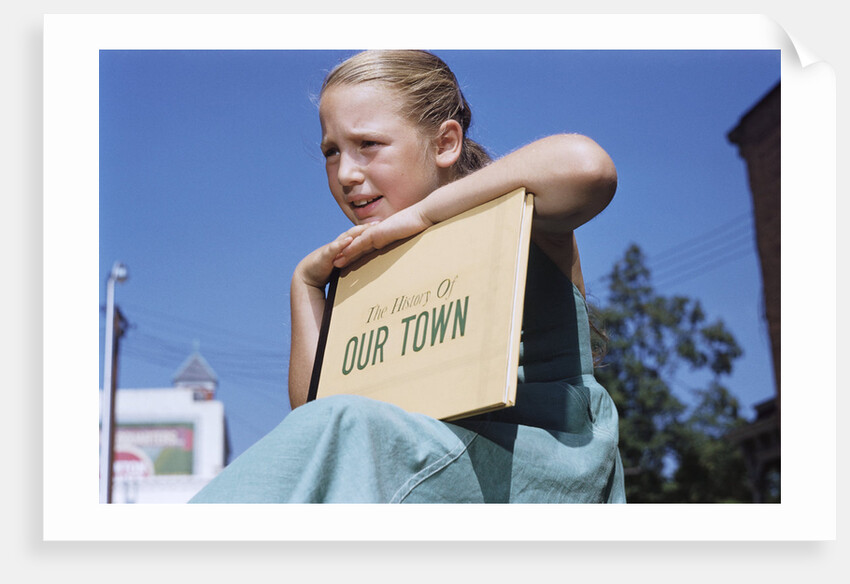 Girl Holding Town History Book by Anonymous