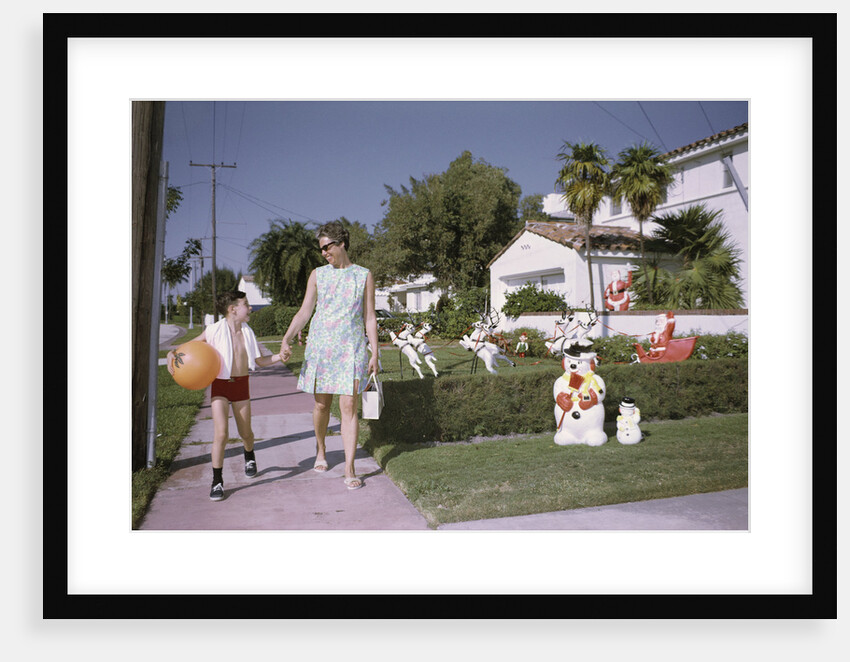 Mother and Son Walking by Christmas Decorations on Yards by Anonymous