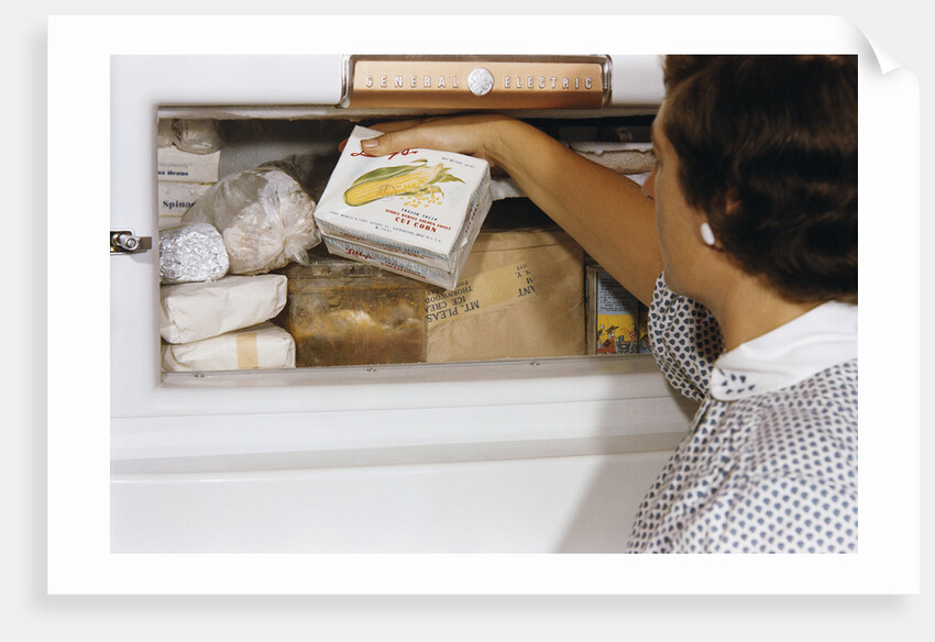 Woman Holding Box of Frozen Corn by Anonymous