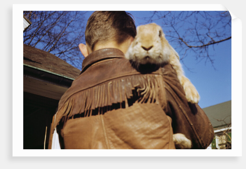 Boy Carrying Rabbit by Anonymous