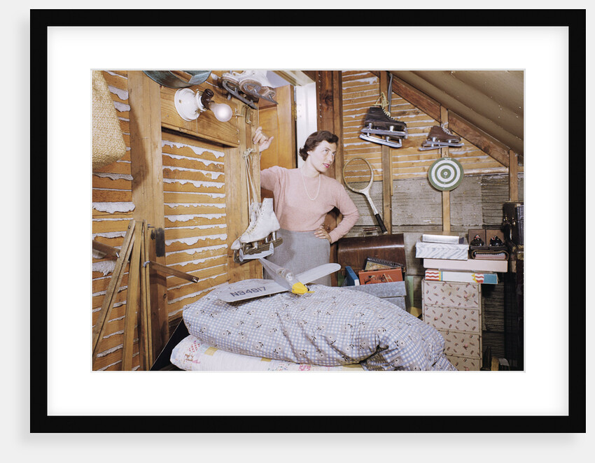 Woman Standing in an Attic by Anonymous