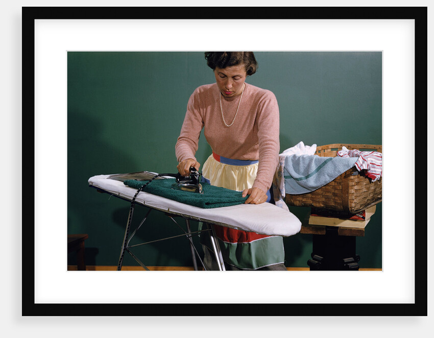 Woman Ironing at Home by Anonymous