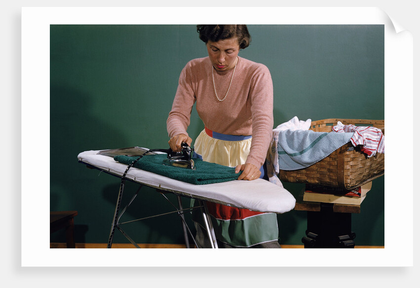 Woman Ironing at Home by Anonymous