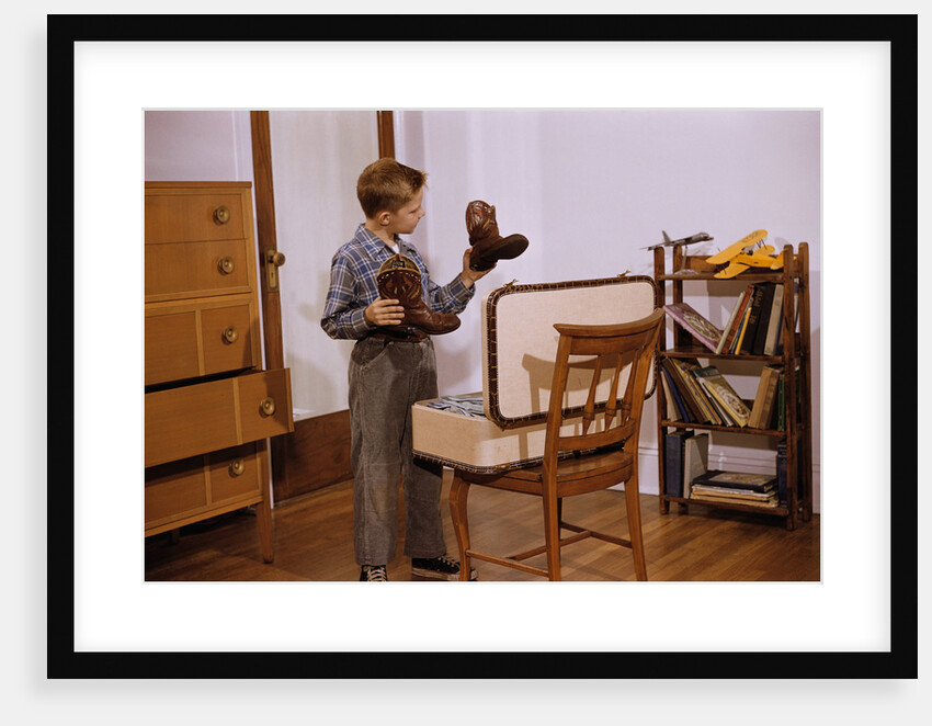 Boy Looking at Cowboy Boots by Anonymous