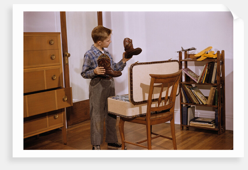 Boy Looking at Cowboy Boots by Anonymous
