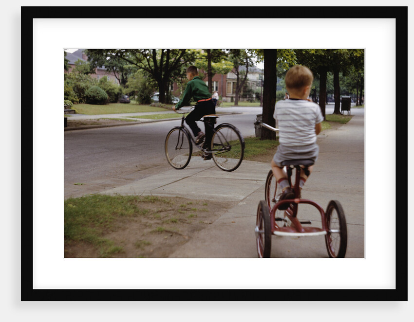 Boys Riding Their Bike and Tricycle by Anonymous