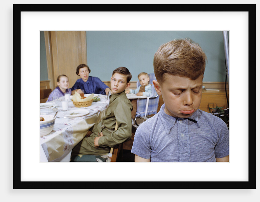 Boy Pouting near the Dinner Table by Anonymous