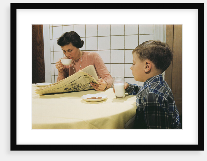 Boy Eating Cookies and Milk as Mom Reads by Anonymous