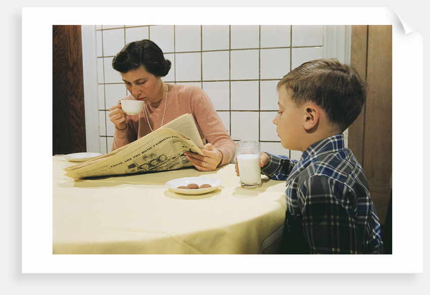 Boy Eating Cookies and Milk as Mom Reads by Anonymous