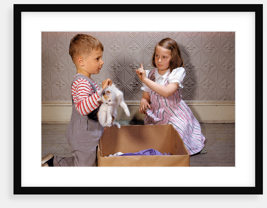 Boy Holding Kitten by Anonymous