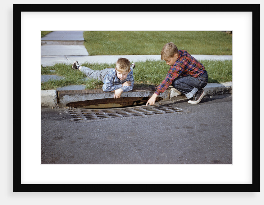 Boys Looking into Grate by Anonymous
