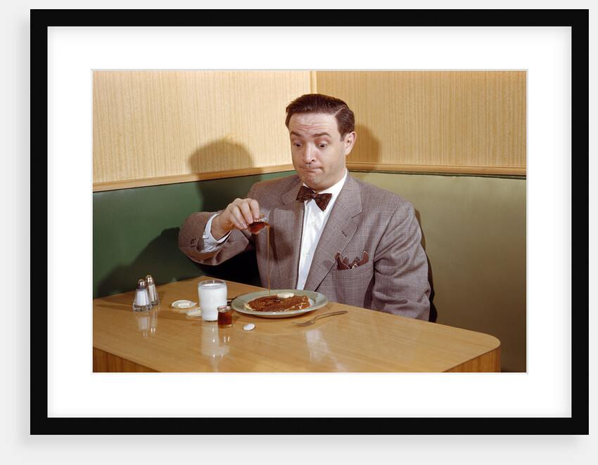 Businessman Pouring Syrup on Pancakes by Anonymous