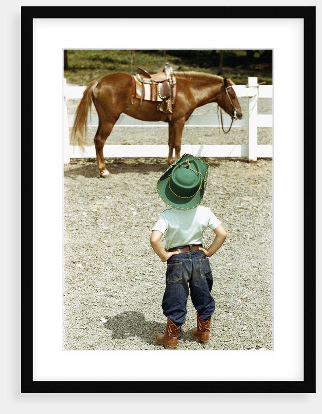 Young Cowboy Looking at Horse by Anonymous