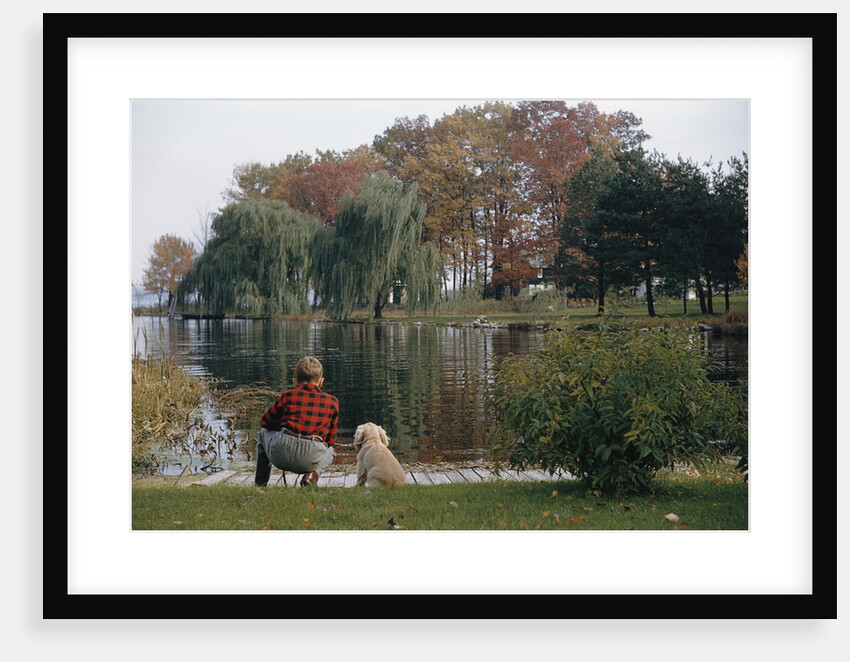 Boy and Dog Looking at Lake by Anonymous