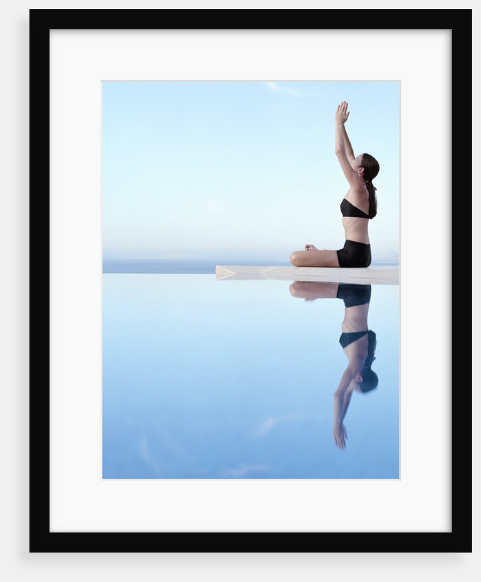 Woman Exercising on Swimming Pool Edge by Anonymous