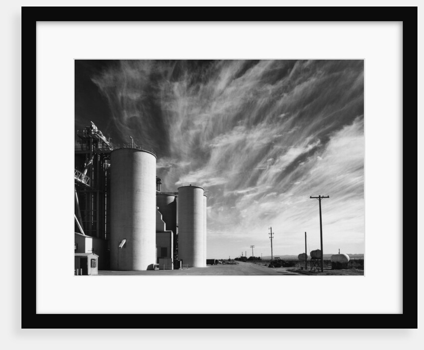 Grain Elevators with Clouds by Gordon Osmundson