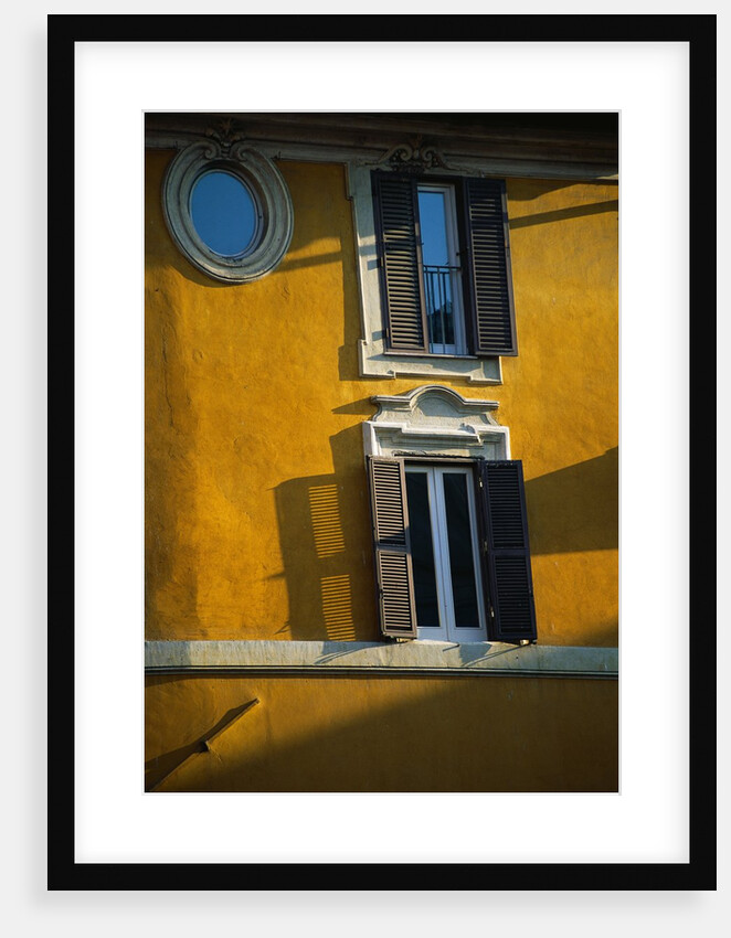 Shuttered Windows on Yellow Building by Anonymous