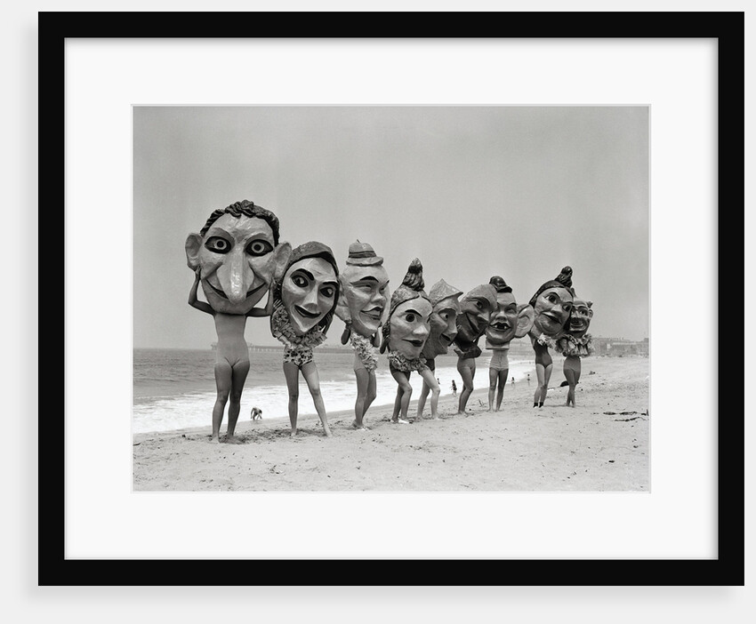 Women Holding Giant Masks by Anonymous