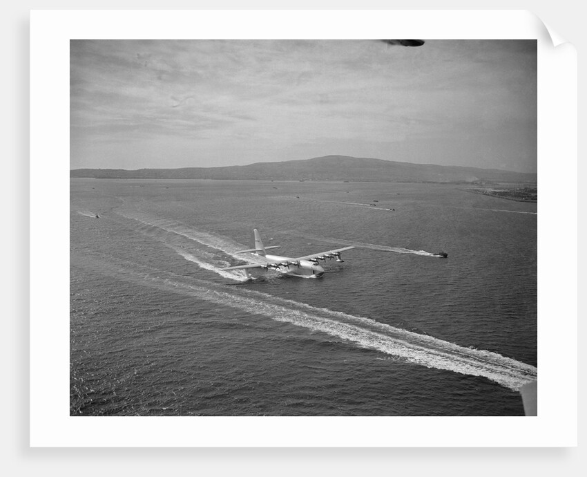 Howard Hughes' Spruce Goose Taxiing Across Water by Anonymous